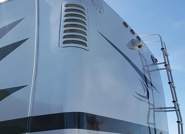 RV sidewall after fiberglass repair and paint